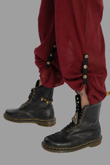 Suspender pant in Thin net fabric.Maroon with ethnic print on suspender and brass studds